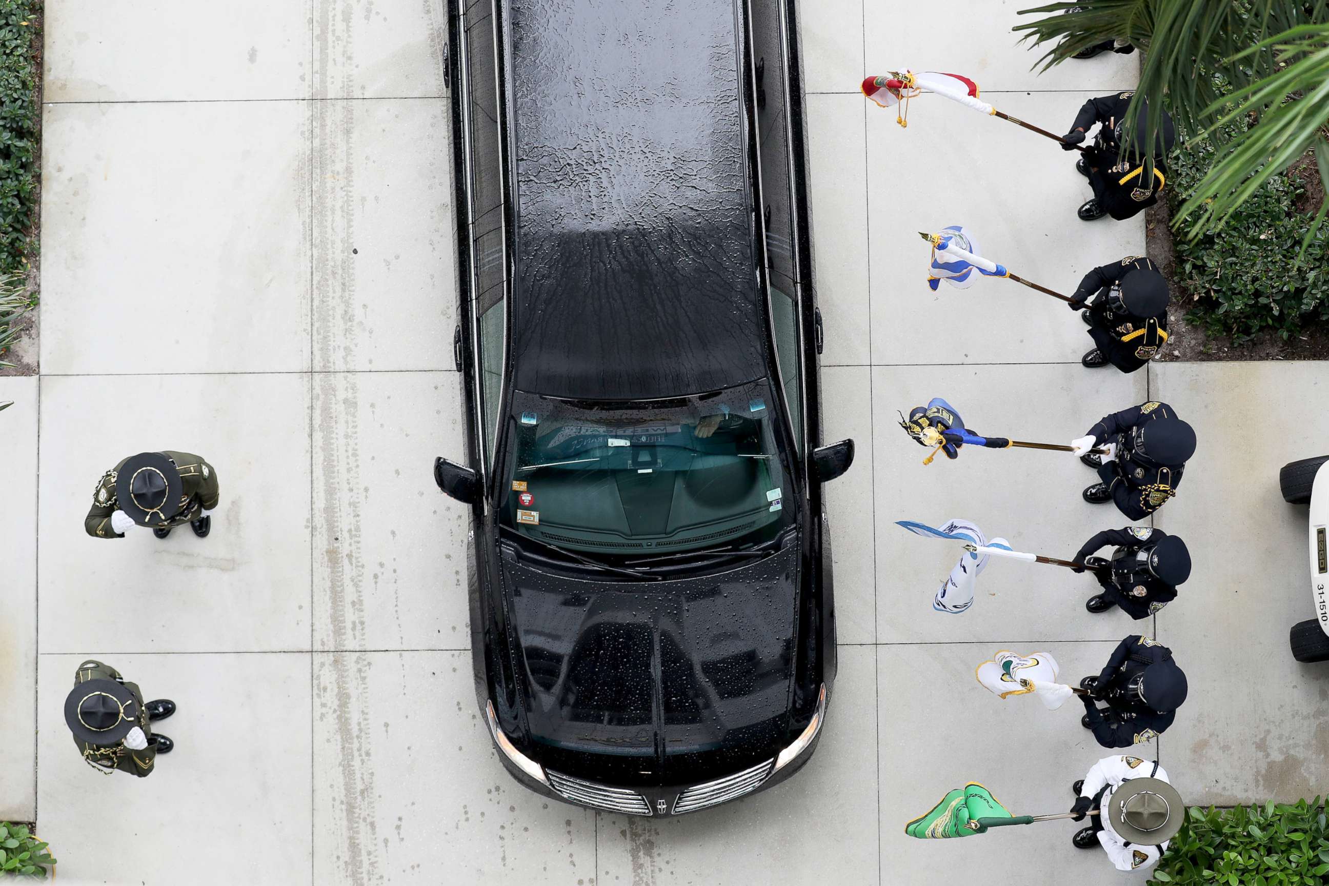 PHOTO: An Honor Guard stands at attention as a vehicle carrying family arrives at the memorial service for slain FBI agent Laura Schwartzenberger in the Hard Rock Stadium in Miami Gardens, Fla., Feb. 6, 2021.