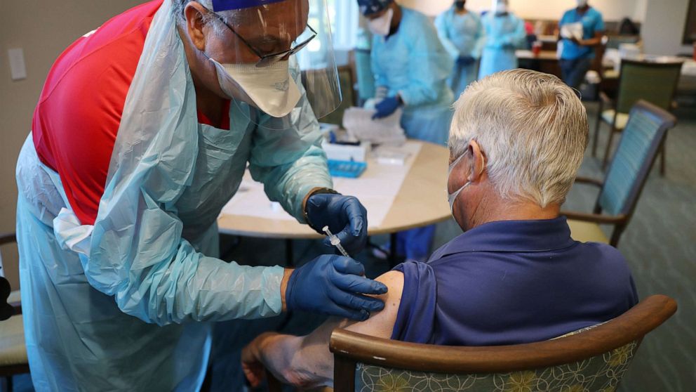 PHOTO: In this Jan. 6, 2021, file photo, a healthcare worker administers a Pfizer-BioNtech COVID-19 vaccine at the John Knox Village Continuing Care Retirement Community in Pompano Beach, Fla.