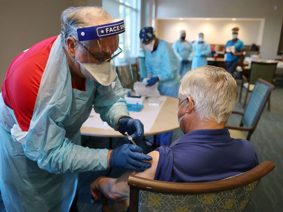 PHOTO: In this Jan. 6, 2021, file photo, a healthcare worker administers a Pfizer-BioNtech COVID-19 vaccine at the John Knox Village Continuing Care Retirement Community in Pompano Beach, Fla.
