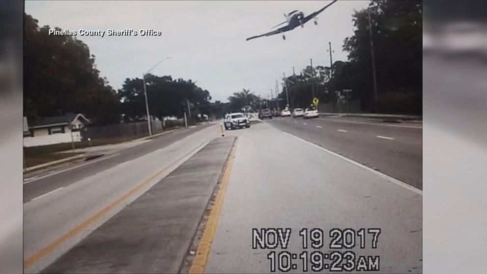 PHOTO: A small plane captured on video by a sheriff's deputy squad car banks over a road before crashing in Clearwater, Fla., Nov. 19, 2017.