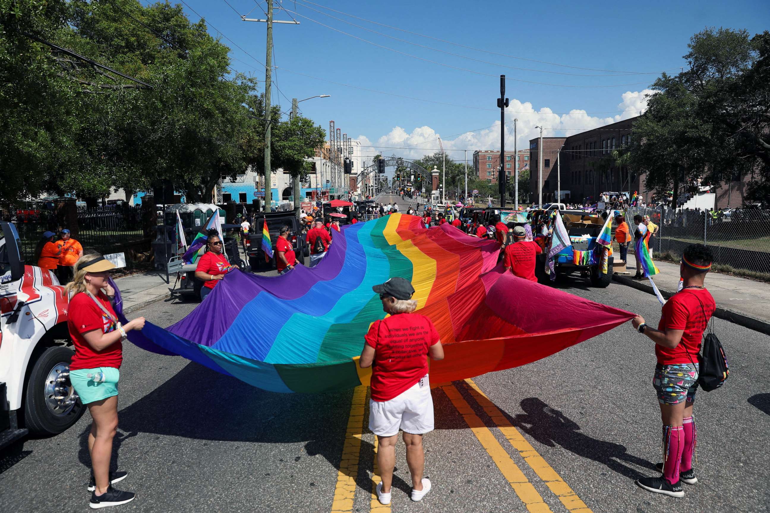 PHOTO: FILE - A group holds a rainbow flag while celebrating the start of the Tampa Pride Parade in the Ybor City neighborhood of Tampa, Fla., March 25, 2023