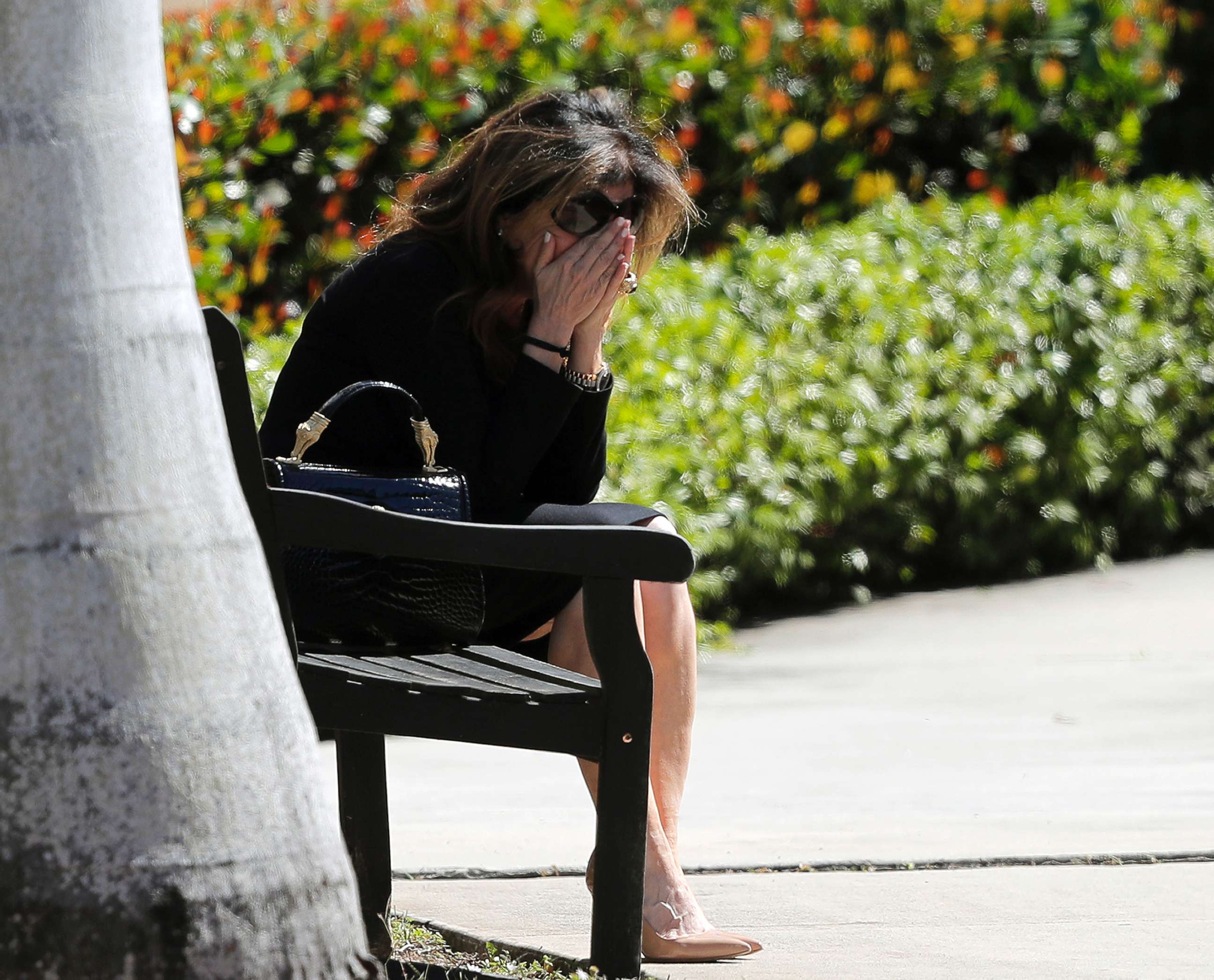 PHOTO: A woman weeps as she sits outside the Temple K'ol Tikvah before the funeral of Meadow Pollack, a victim of the Wednesday shooting at Marjory Stoneman Douglas High School, in Parkland, Fla., Feb. 16, 2018.