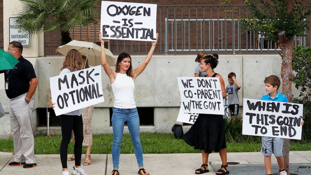 PHOTO: Families protest any potential mask mandates before the Hillsborough County Schools Board meeting held at the district office in Tampa, Fla., July 27, 2021.