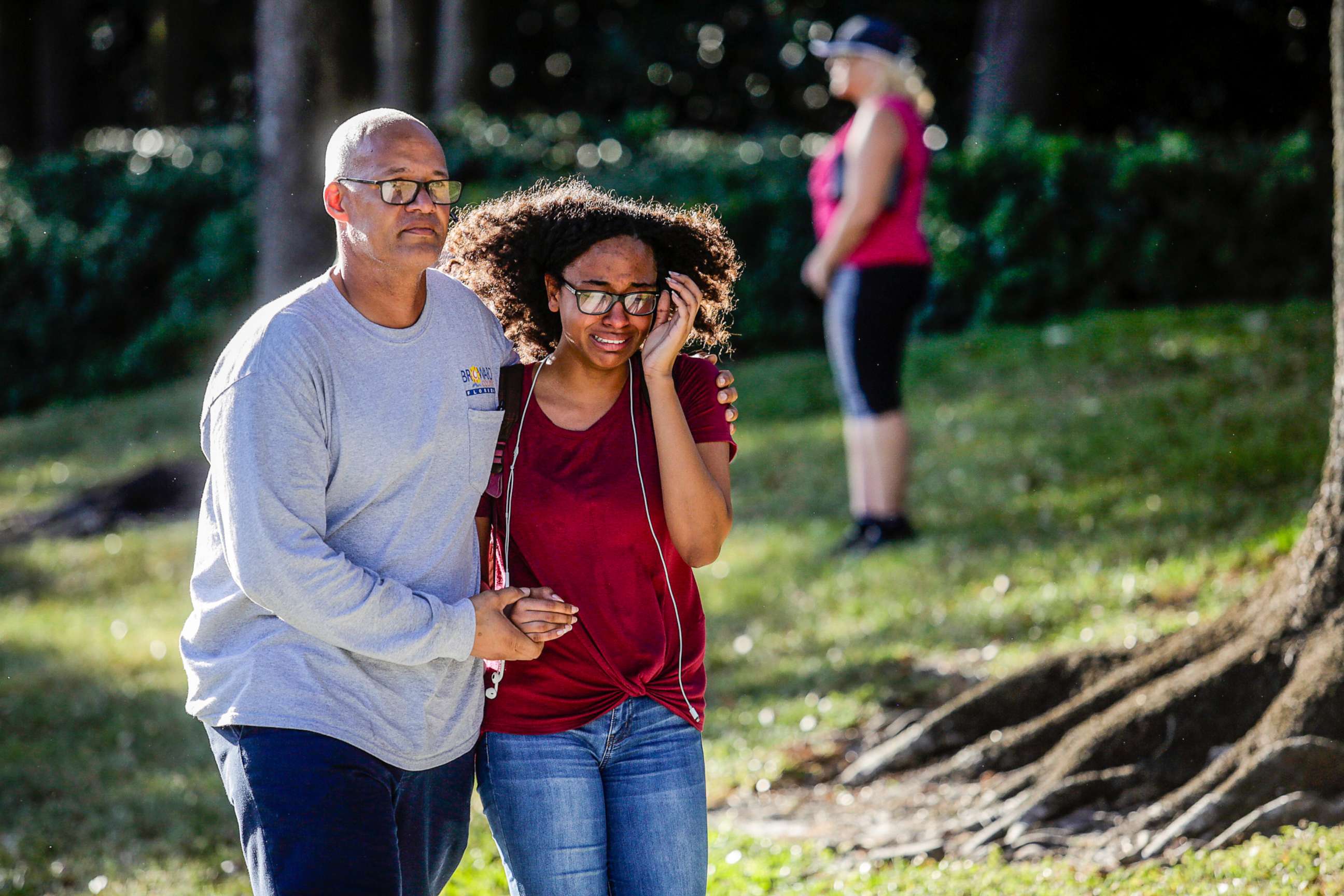 PHOTO: A father and daughter embrace after a mass shooting at the Marjory Stoneman Douglas High School in Parkland, Fla., Feb. 14, 2018. 