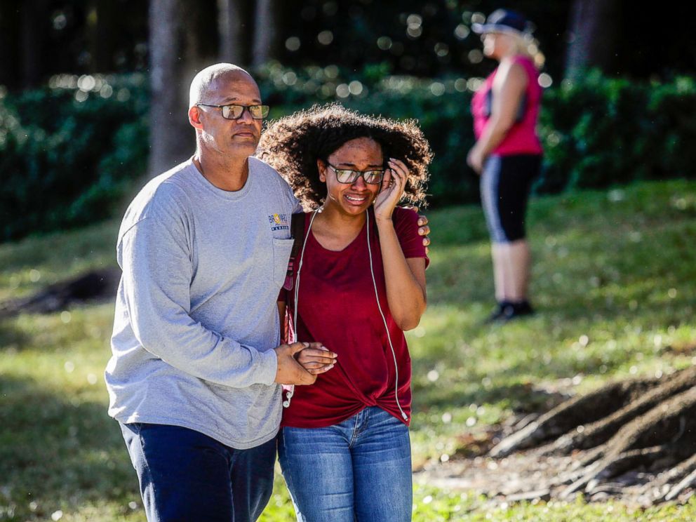PHOTO: A father and daughter embrace after a mass shooting at the Marjory Stoneman Douglas High School in Parkland, Fla., Feb. 14, 2018.