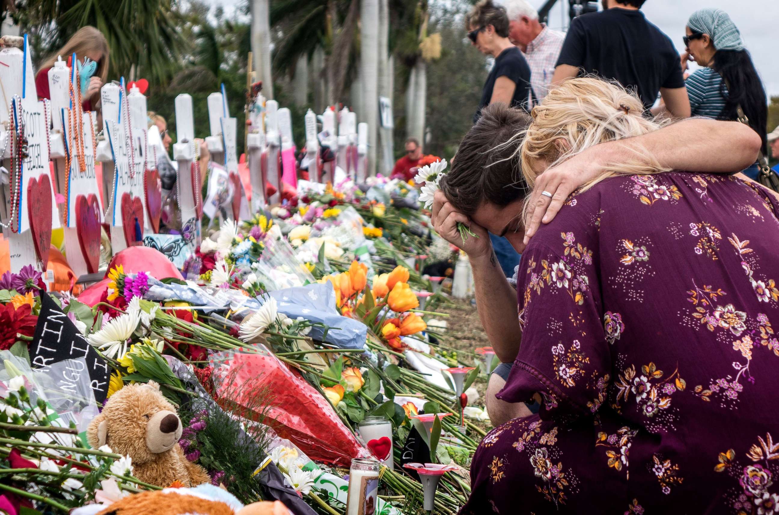 PHOTO: People visit a makeshift memorial in front of the Marjory Stoneman Douglas High School in, Parkland, Florida, Feb. 20, 2018. 