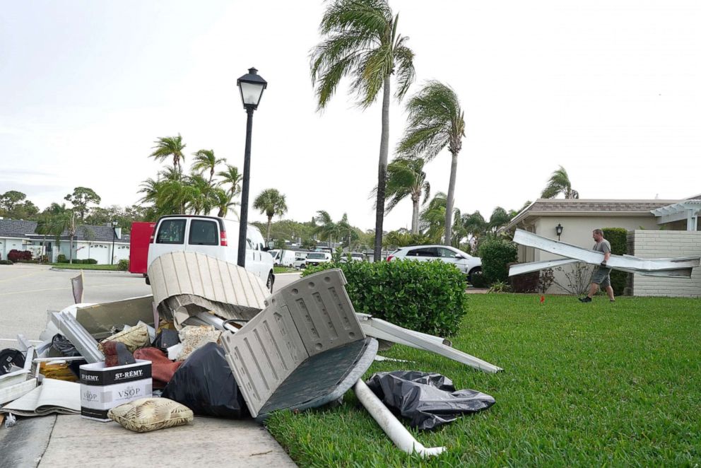 PHOTO: Residents and construction crews work to cleanup the damage a tornado caused overnight at the Boca Ciega Point condominiums on Feb. 14, 2021, in St. Petersburg, Fla.