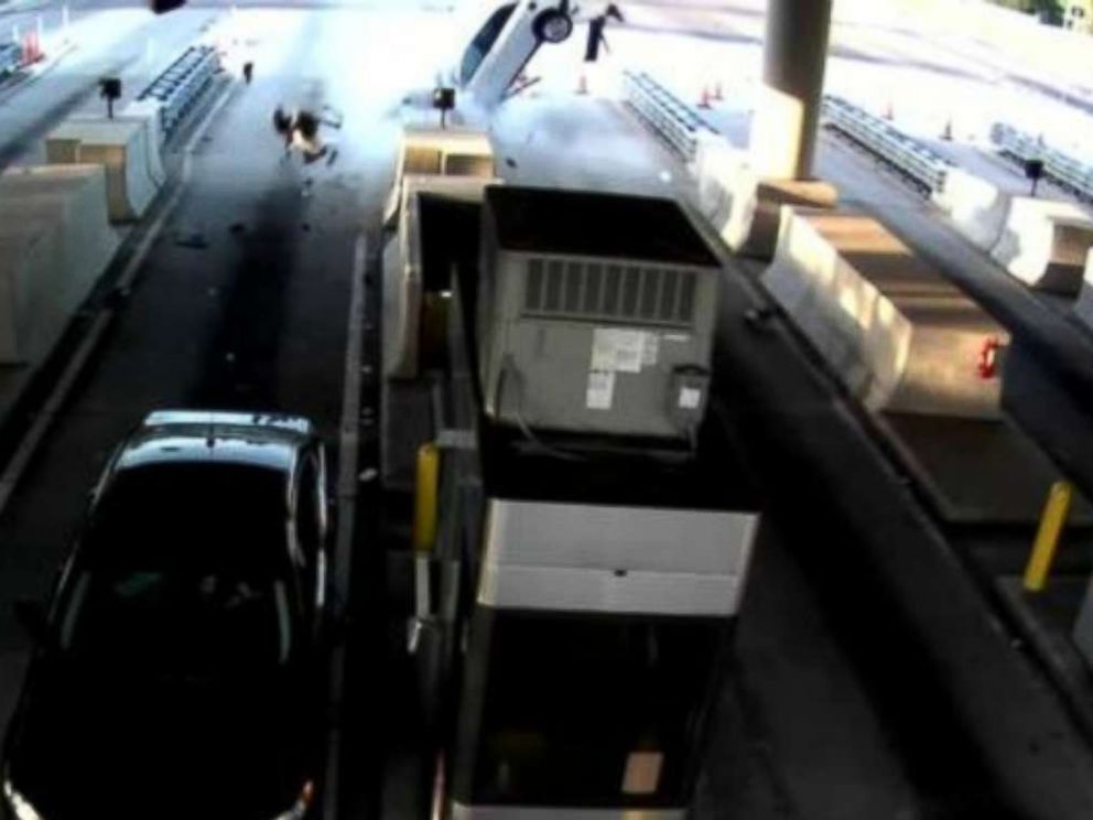 A man is seen ejected from a vehicle in Florida after crashing into a toll booth on Monday, June 11, 2018.