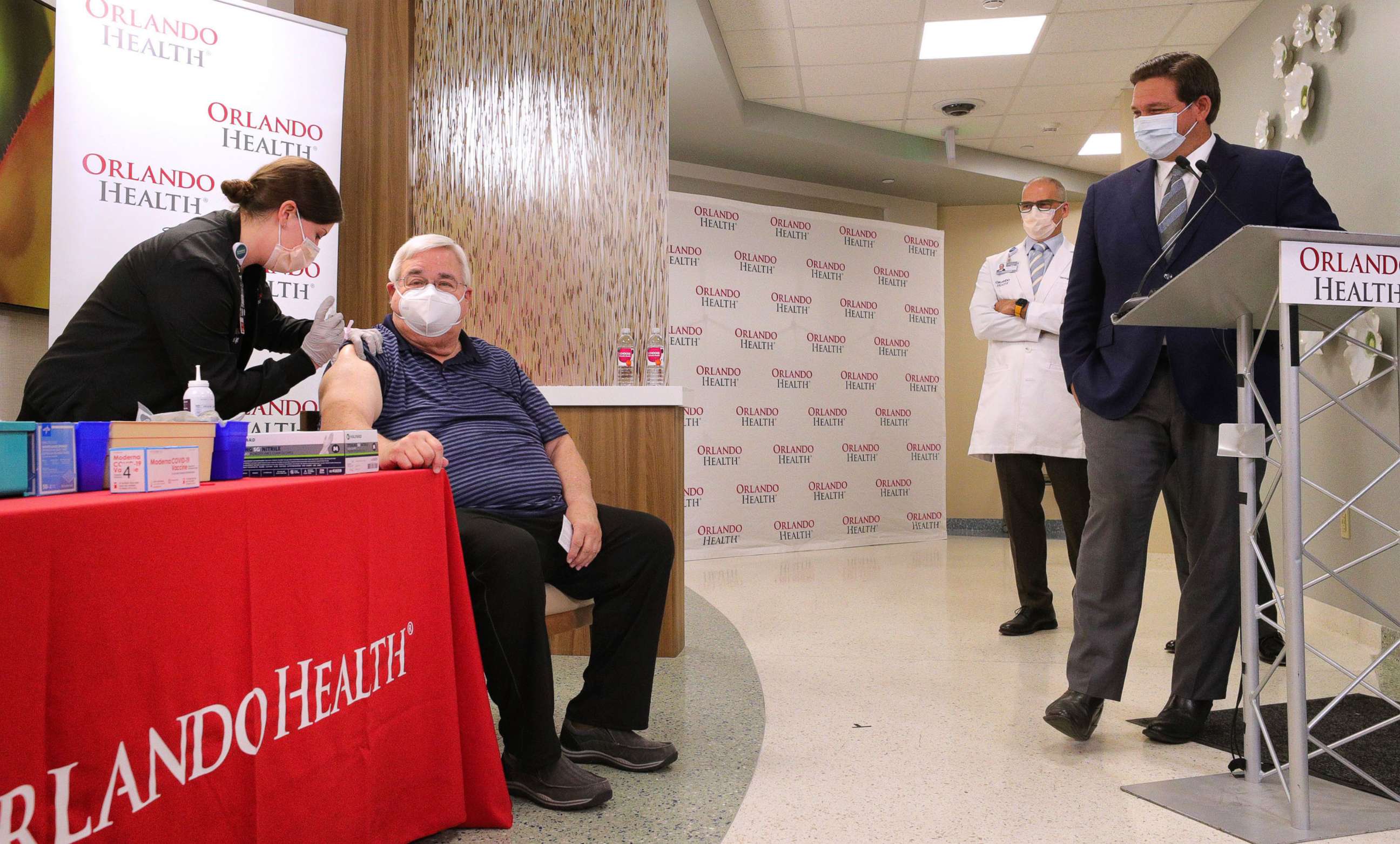 PHOTO: Florida Gov. Ron DeSantis watches someone receive the Moderna vaccine for COVID-19 at Orlando Health South Seminole Hospital on Jan. 4, 2021, in Longwood, Fla.