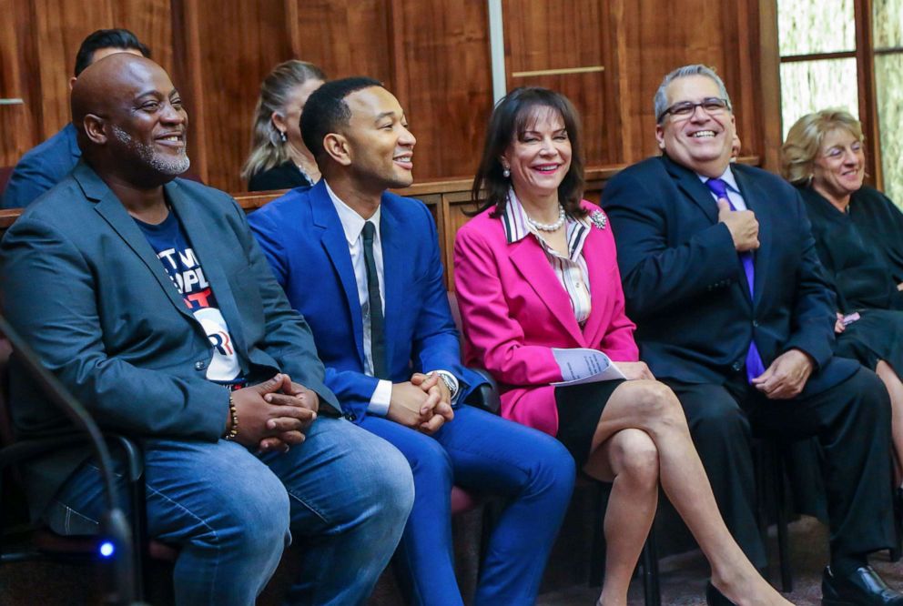 PHOTO: John Legend (2L), Desmond Meade (L), State Attorney Katherine Fernandez Rundle (2R) and Public defender Carlos Martinez (R) sit during a special court hearing aimed at restoring the right to vote under Florida's amendment 4, Nov. 8, 2019, in Miami.