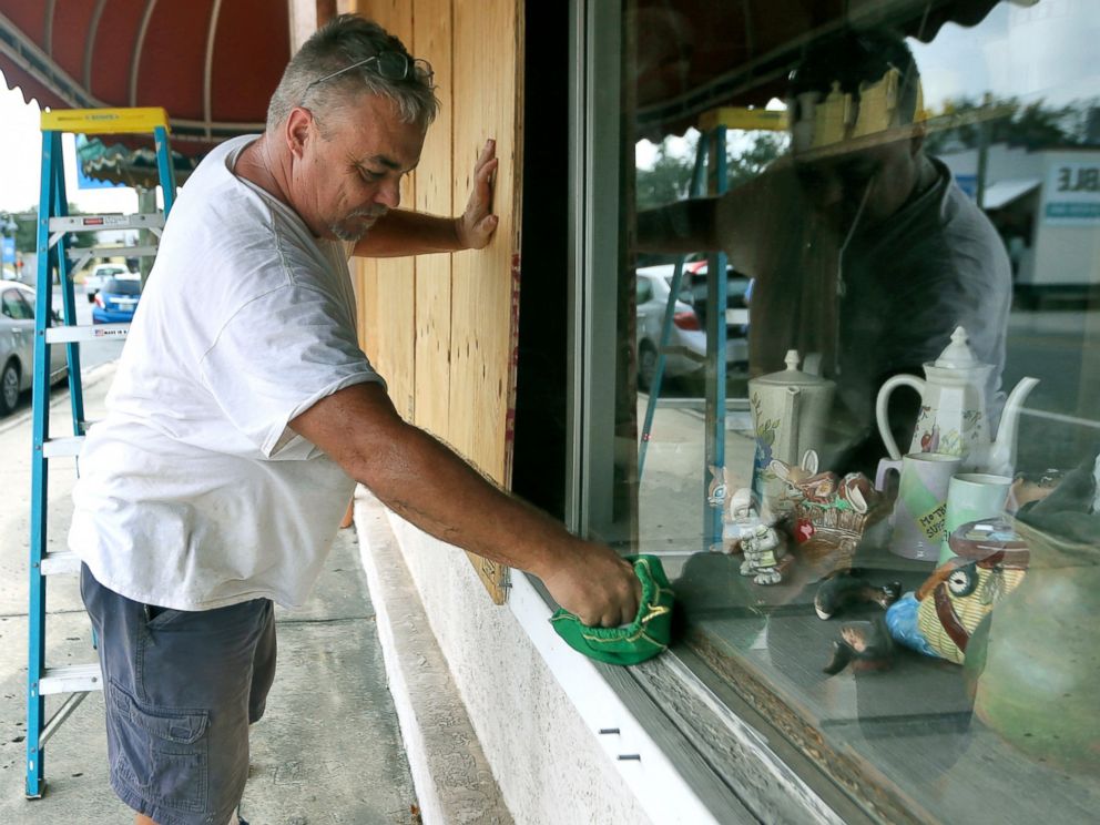 PHOTO: Bobby Smith boards up the windows at Janis Ceramics in Panama City, Fla., on Monday, Oct. 8, 2018, in preparation for the arrival of Hurricane Michael.