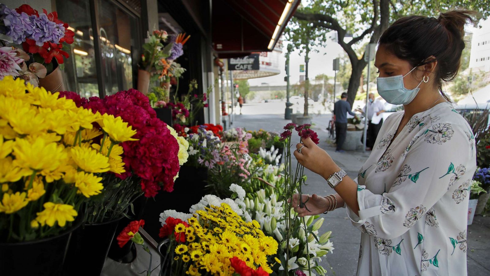 Florist Working In Her Flower Shop. by Stocksy Contributor