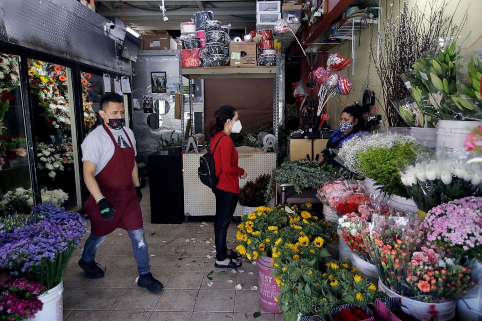 PHOTO: Flowers are sold at the Los Angeles Flower Market Wednesday, May 6, 2020, in Los Angeles. Los Angeles Mayor Eric Garcetti on Tuesday said he would allow wholesale florists to open as a horticultural exemption for the upcoming Mother's Day.