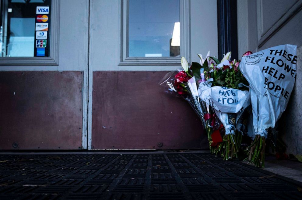PHOTO: Flowers rest in front of the door of Half Moon Bay City Hall, Jan. 24, 2023., in Half Moon Bay, Calif.