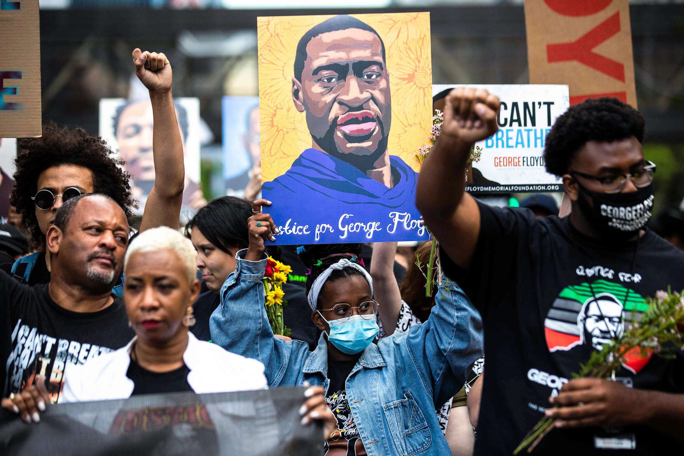 PHOTO: People march during an event in remembrance of George Floyd in Minneapolis, May 23, 2021, as the one year anniversary approaches.