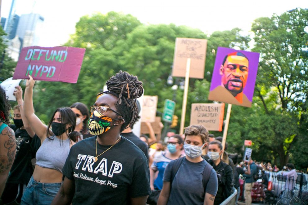 PHOTO: Protesters march through Brooklyn Bridge on June 25, 2020 in New York, N.Y. Among other demands, the activists want to see a defunding of the New York City Police Department.