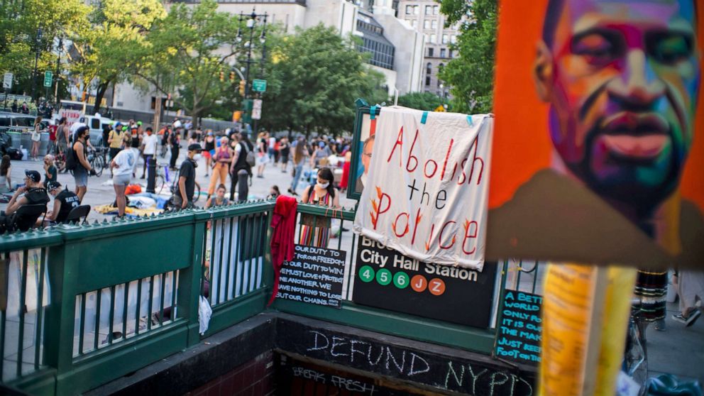 PHOTO: A sign that reads "Abolish the police" is seen during a march near NYC City hall on June 25, 2020 in New York, N.Y. 