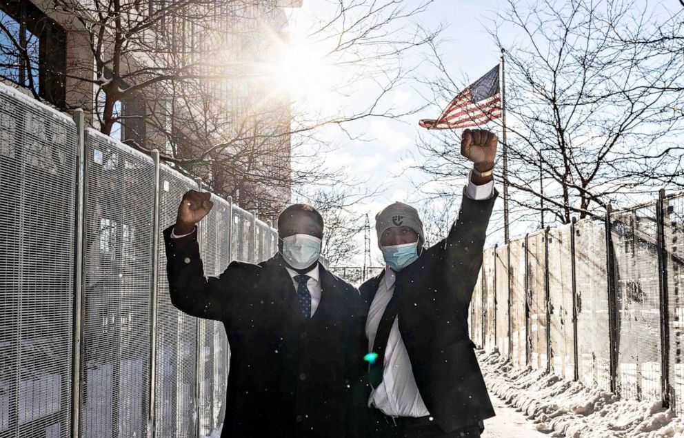 PHOTO: George Floyd's brother Philonise Floyd, right, and nephew Brandon Williams arrive at the US District Court in St. Paul, Minn. on Jan. 24, 2022.