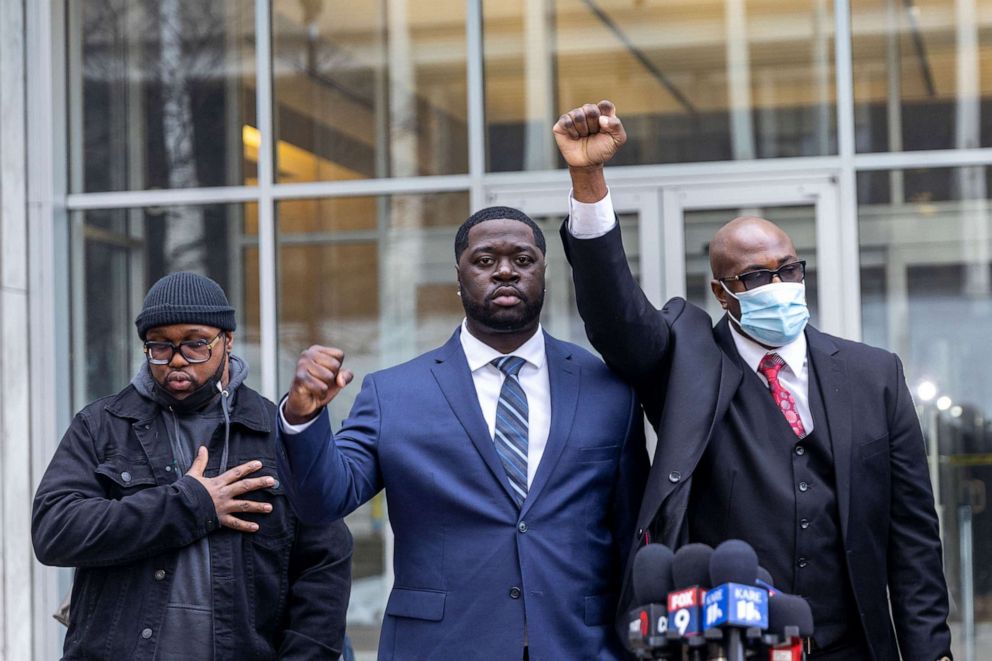 PHOTO: Philonise Floyd and Terrence Floyd George Floyd's brothers, and nephew Brandon Williams attend a press conference outside the US District Court in St Paul, Minnesota on December 15, 2021.