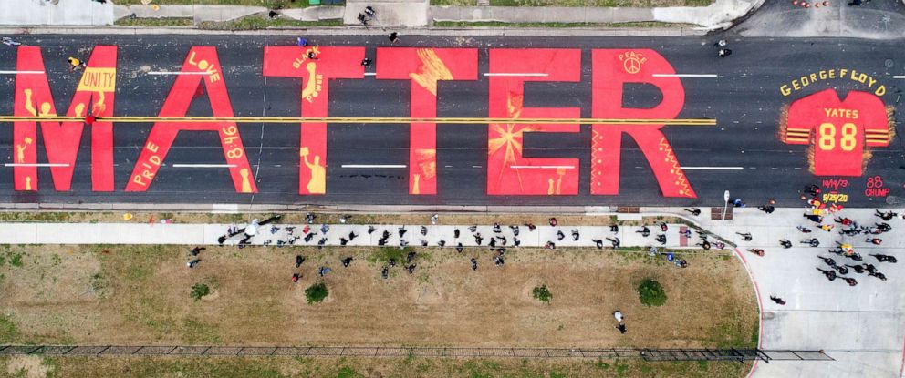 PHOTO: Part of the mural by Third Ward native Jonah Elijah in honor of Black History Month and George Floyd is placed in front of Jack Yates High School in Houston, Texas, Feb. 6, 2021.