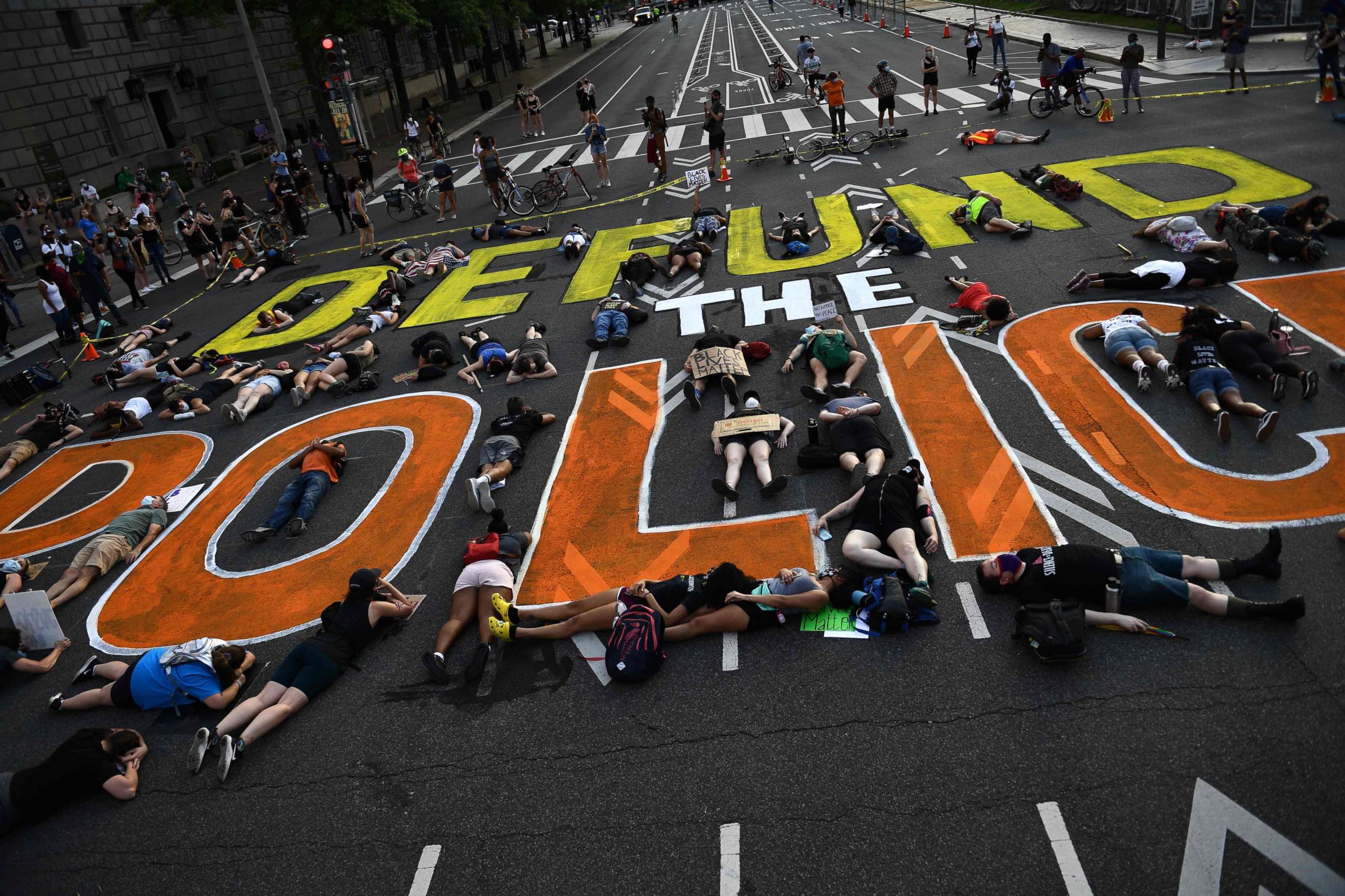 PHOTO: Demonstrators lie on the pavement during a peaceful protest against police brutality and racism, June 6, 2020, in Washington, DC.