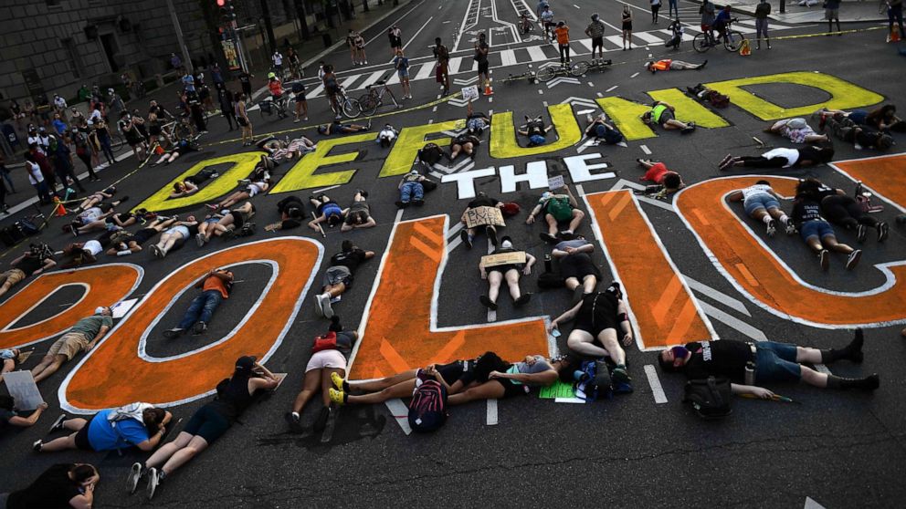 PHOTO: Demonstrators lie on the pavement during a peaceful protest against police brutality and racism, June 6, 2020, in Washington, DC.