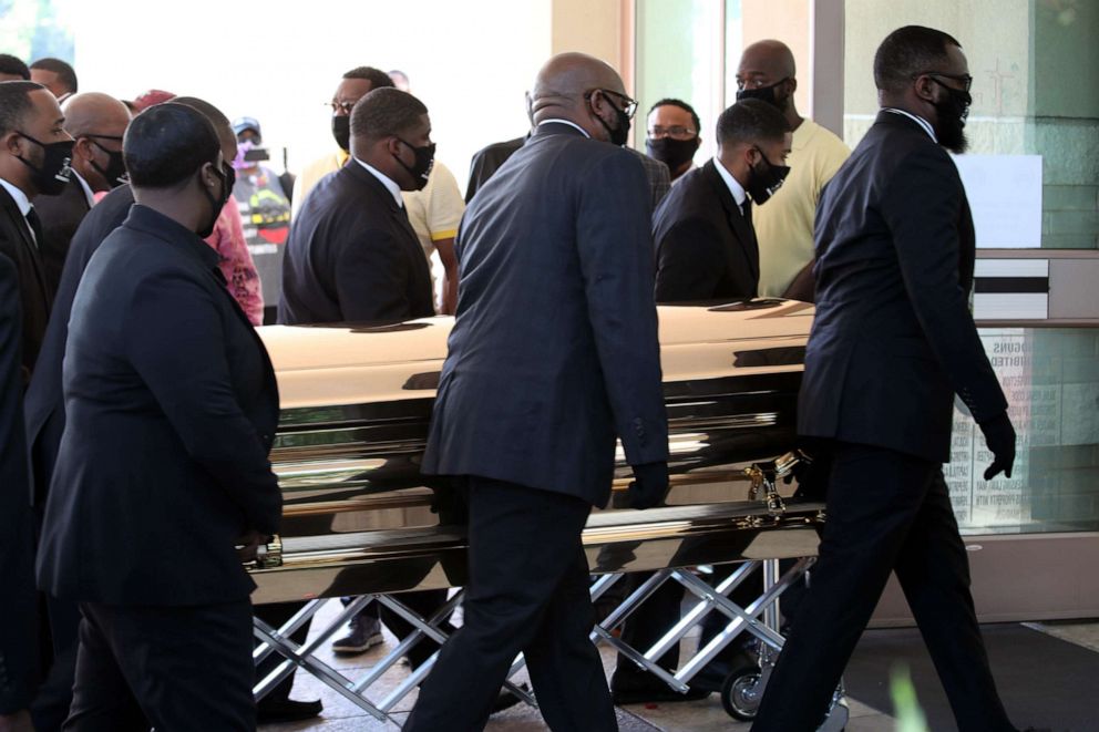 PHOTO: Men carry the coffin of George Floyd at The Fountain of Praise church in Houston, June 8, 2020.