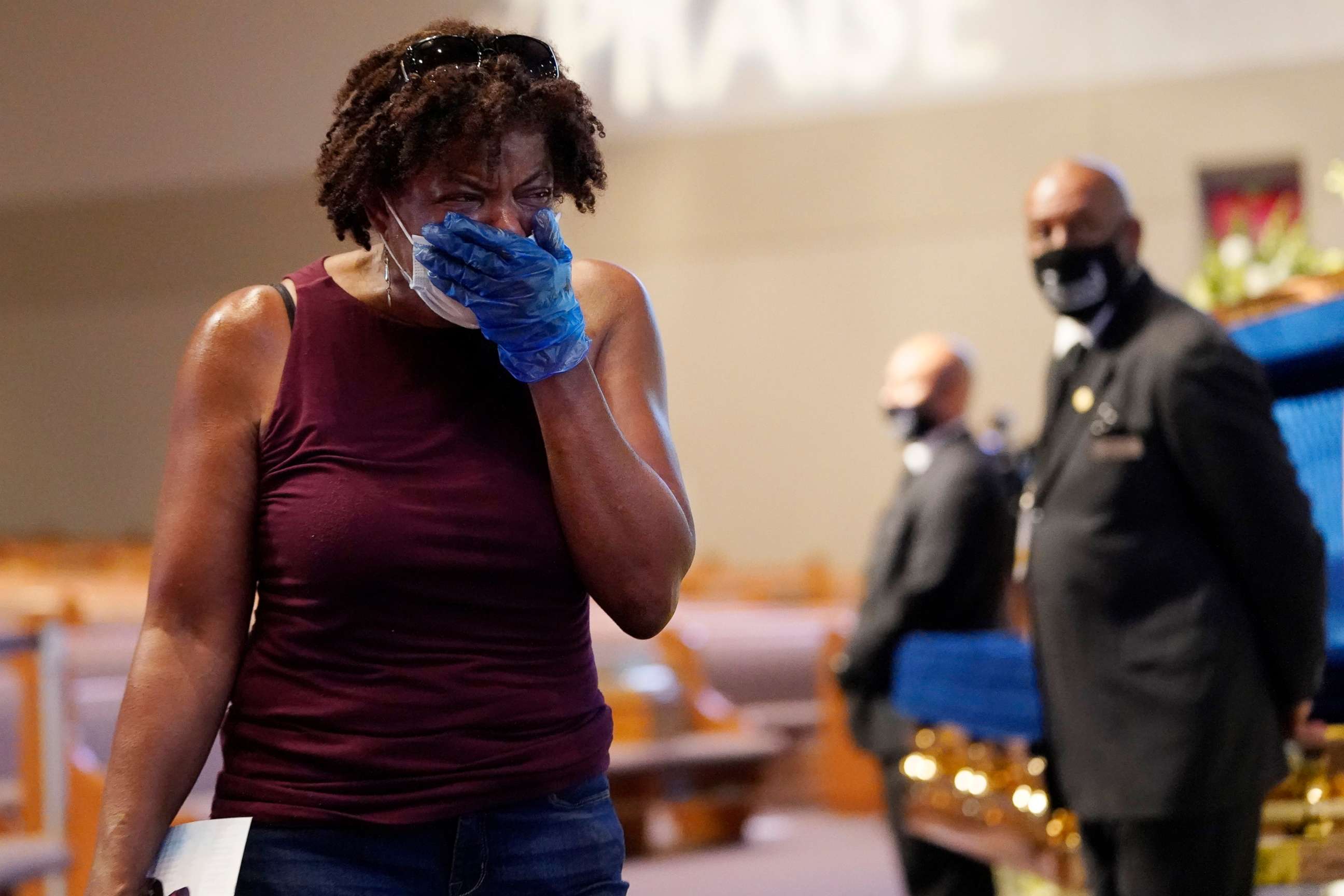 PHOTO: Mourner Charlene Thompson, of Houston, passes by the casket of George Floyd during a public visitation for Floyd at the Fountain of Praise church, June 8, 2020, in Houston. 