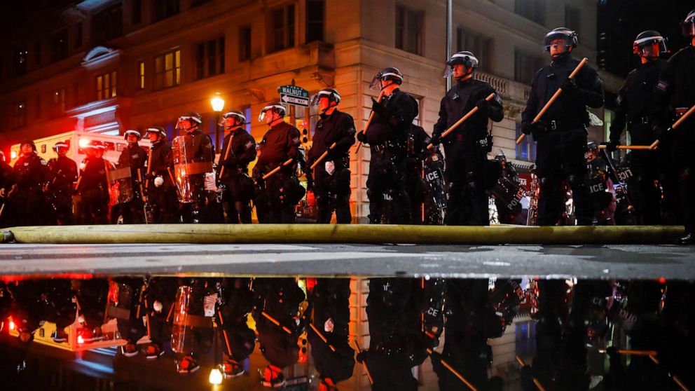 PHOTO: Police are reflected as they stand guard, May 30, 2020, in Philadelphia, during a protest over the death of George Floyd.