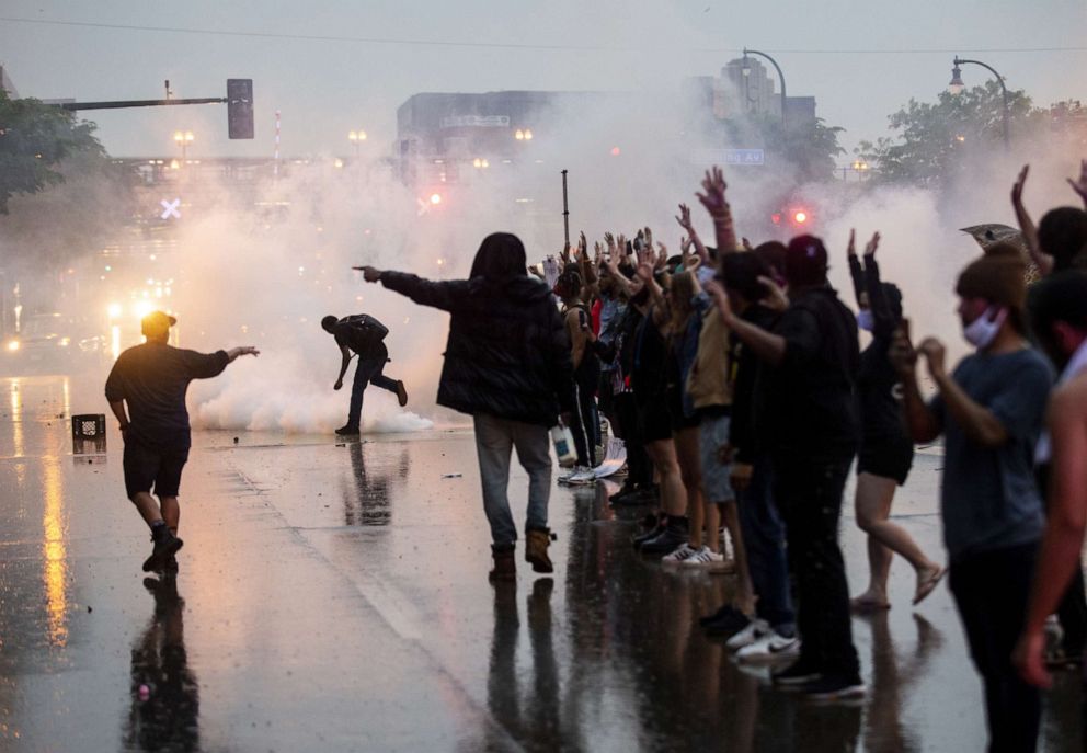 PHOTO: Tear gas is fired as protesters clash with police while demonstrating against the death of George Floyd outside the 3rd Precinct Police Precinct, May 26, 2020, in Minneapolis, Minnesota.