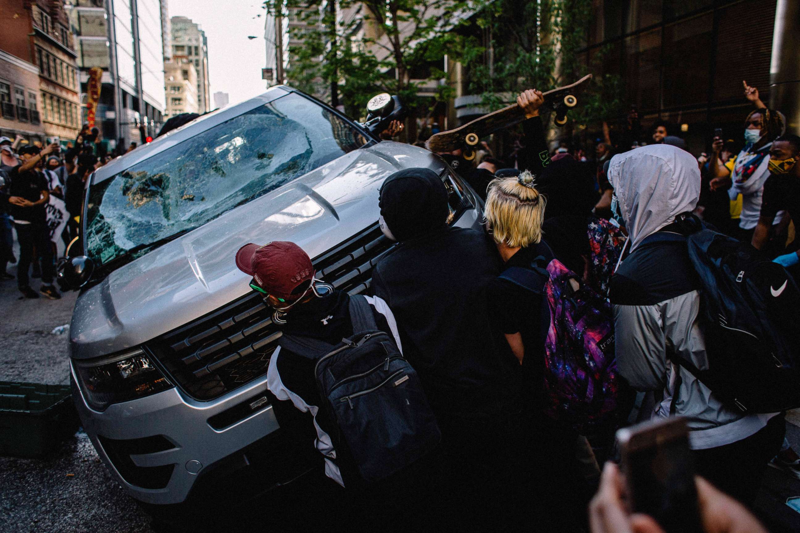 PHOTO: Protesters destroy a Chicago Police Vehicle, May 30, 2020, during a protest against the death of George Floyd.