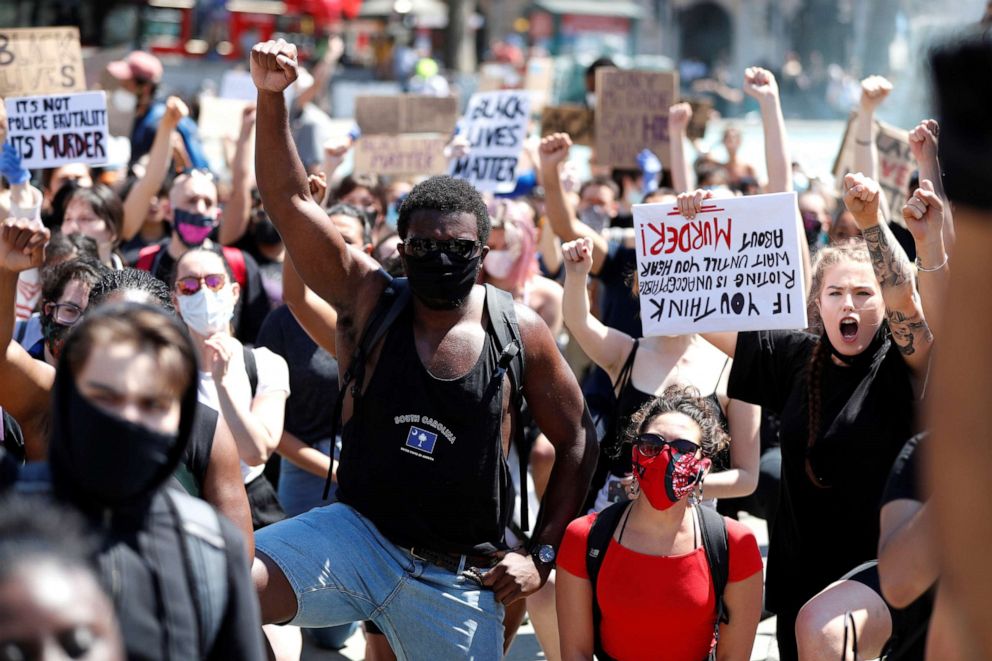 PHOTO: People react during a protest against the death in Minneapolis police custody of African-American man George Floyd, in Trafalgar Square, London, May 31, 2020.