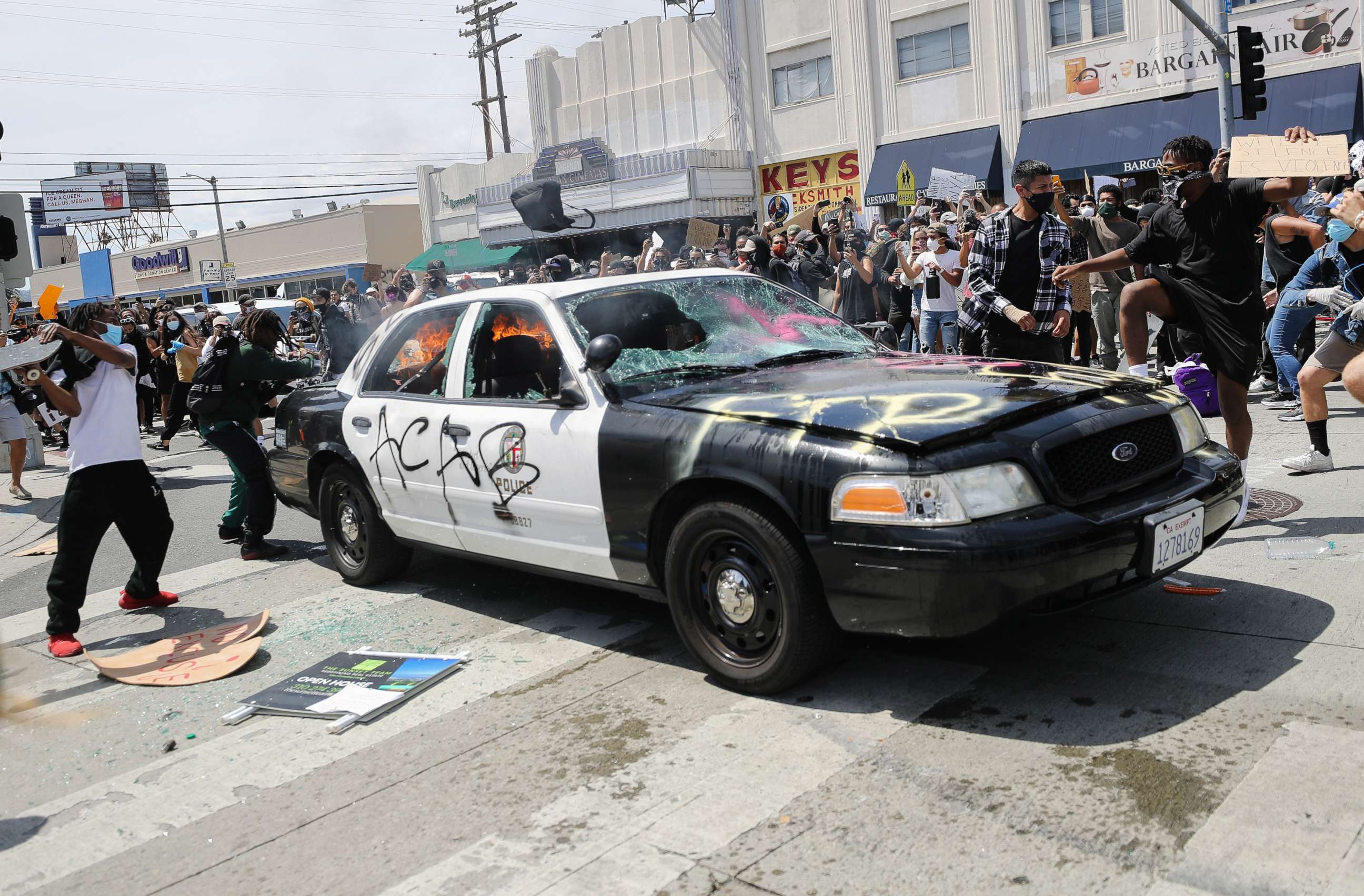 PHOTO: An LAPD vehicle begins to burn after being set alight by protestors during demonstrations following the death of George Floyd, May 30, 2020, in Los Angeles.