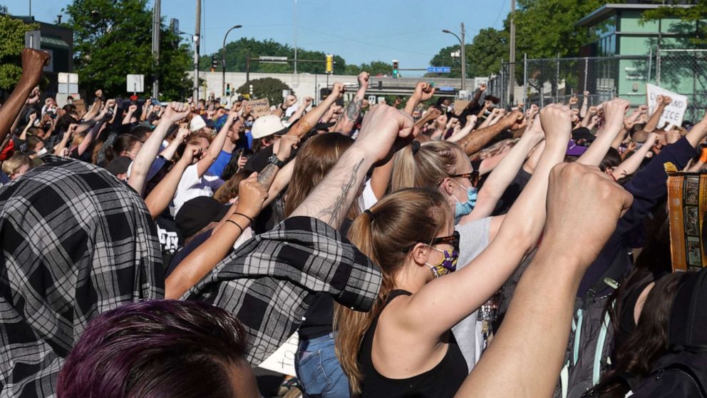 PHOTO: Demonstrators protest the killing of George Floyd near the city's 5th police precinct on May 30, 2020 in Minneapolis, Minnesota. 
