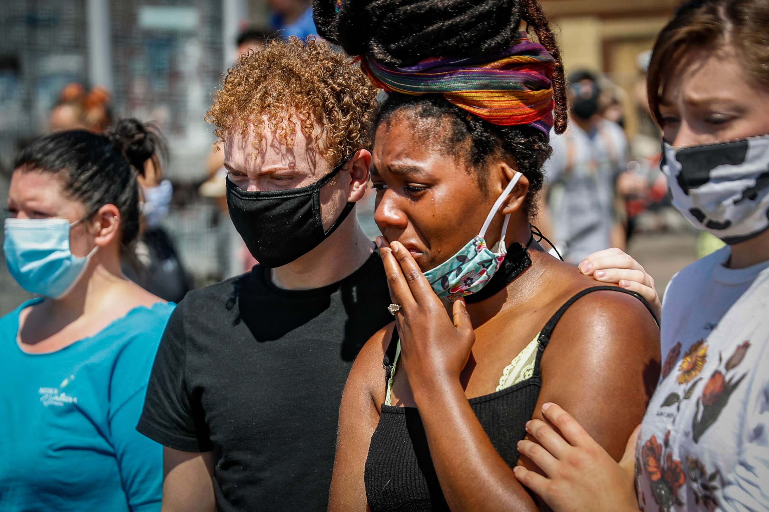 PHOTO: A mourner cries as she visits a makeshift memorial for George Floyd on the corner of Chicago Avenue and East 38th Street, May 31, 2020, in Minneapolis.