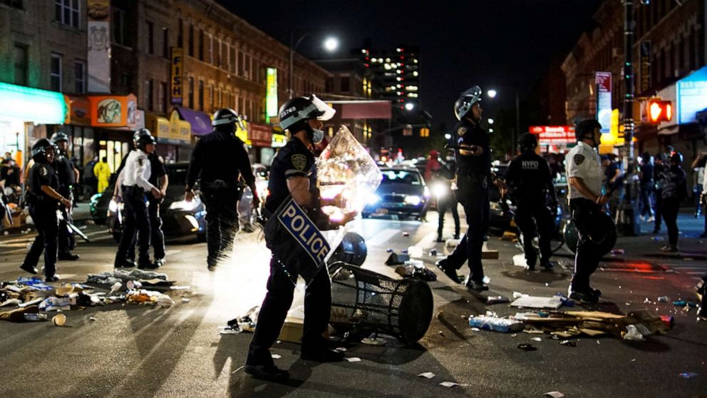 PHOTO: NYPD officers try to keep control on the streets as they clash with protesters during a march against the death in Minneapolis police custody of George Floyd, in the Brooklyn, New York, May 30, 2020.