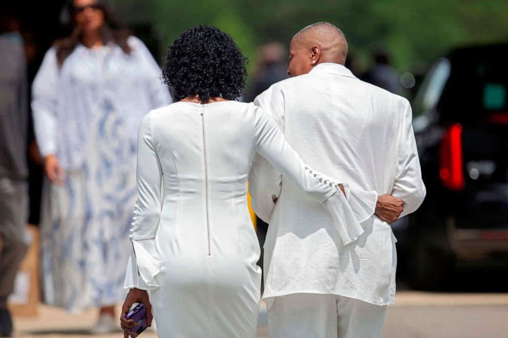 PHOTO: Zsa-Zsa, left, and LaTonya Floyd, sisters of George Floyd, walk to the private viewing and memorial service together outside the Cape Fear Conference B Church in Raeford, N.C., on June 6, 2020, during a memorial for George Floyd.