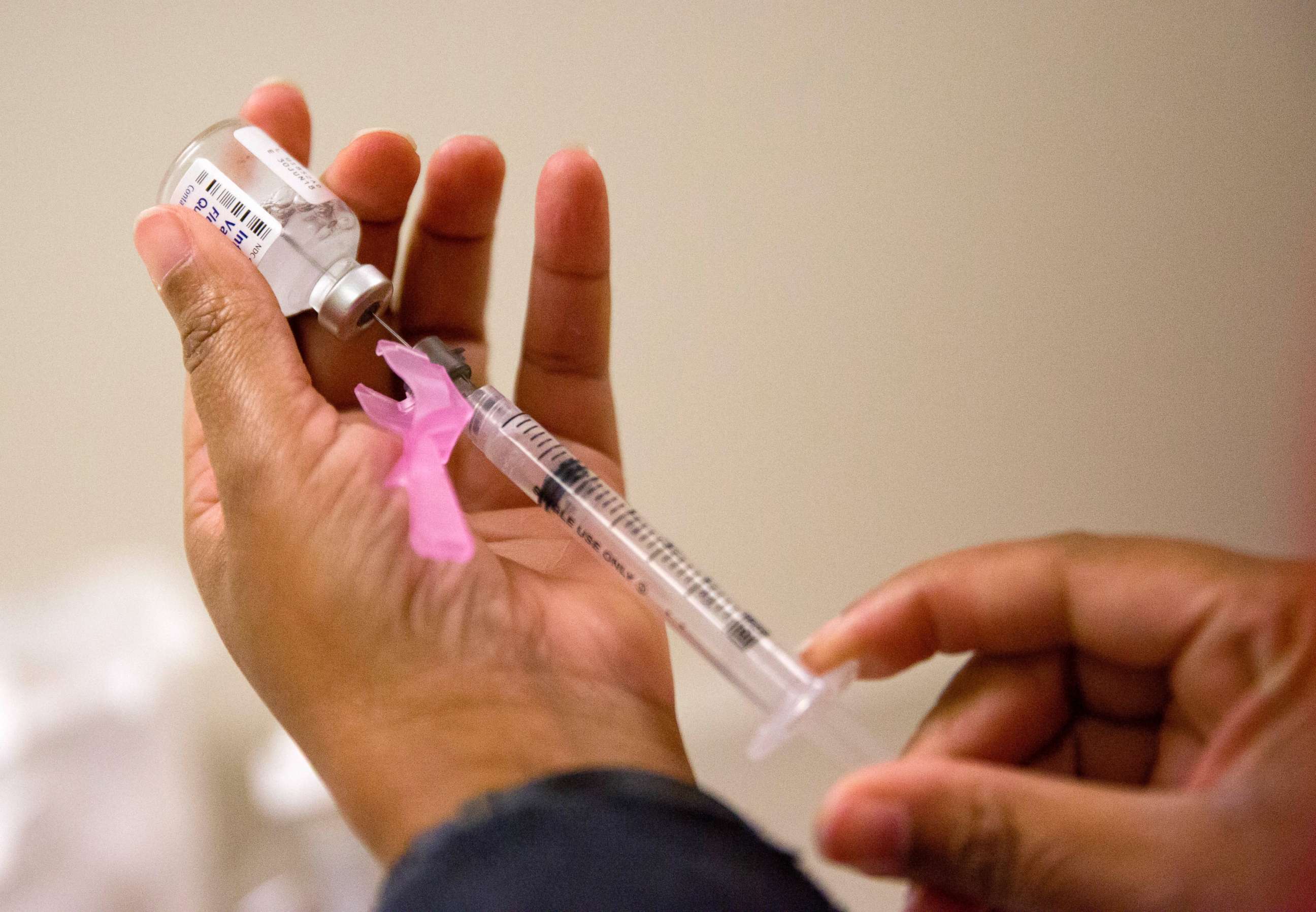 PHOTO: A nurse prepares a flu shot at the Salvation Army in Atlanta, Feb. 7, 2018.