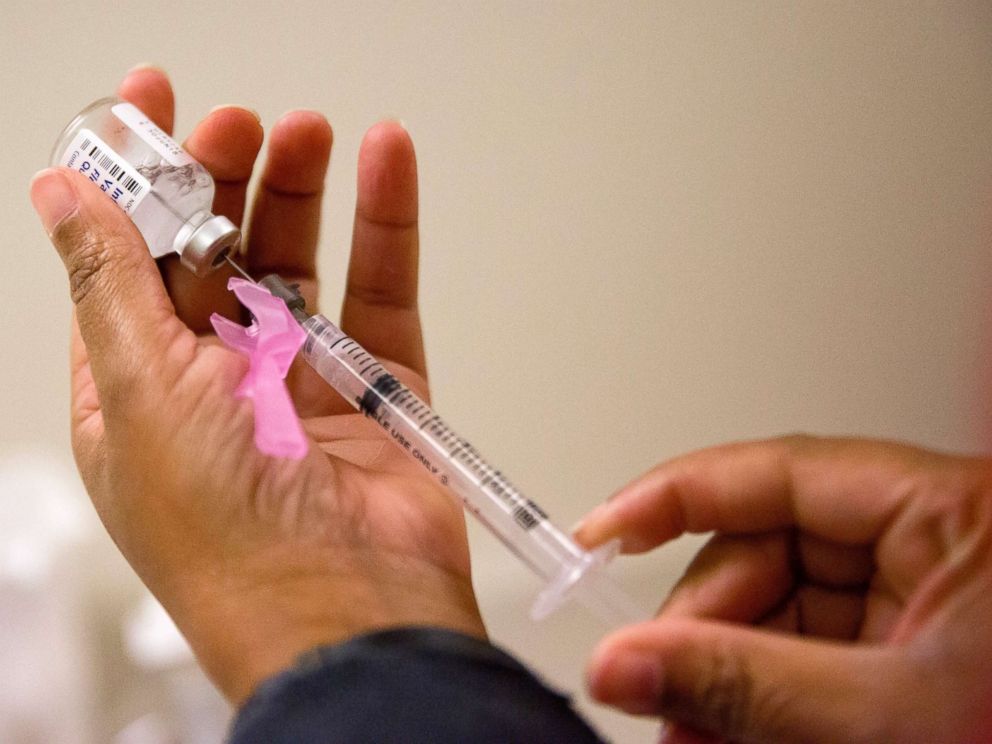 PHOTO: A nurse prepares a flu shot at the Salvation Army in Atlanta, Feb. 7, 2018.