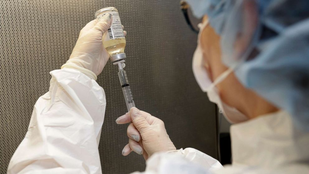 A certified pharmacy technician Peggy Gillespie fills antibiotics into a syringe for use as an I.V. push at ProMedica Toledo Hospital in Toledo, Ohio, Jan. 8, 2018. A nasty flu season is hitting U.S. hospitals already scrambling to maintain patient care amid severe shortages of crucial sterile fluids, particularly saline solution needed to administer I.V. medicines and rehydrate patients. 