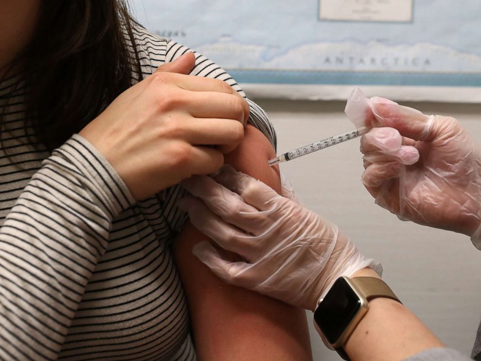 PHOTO: A woman receives a flu shot at a Walgreens phramacy on Jan. 22, 2018 in San Francisco.