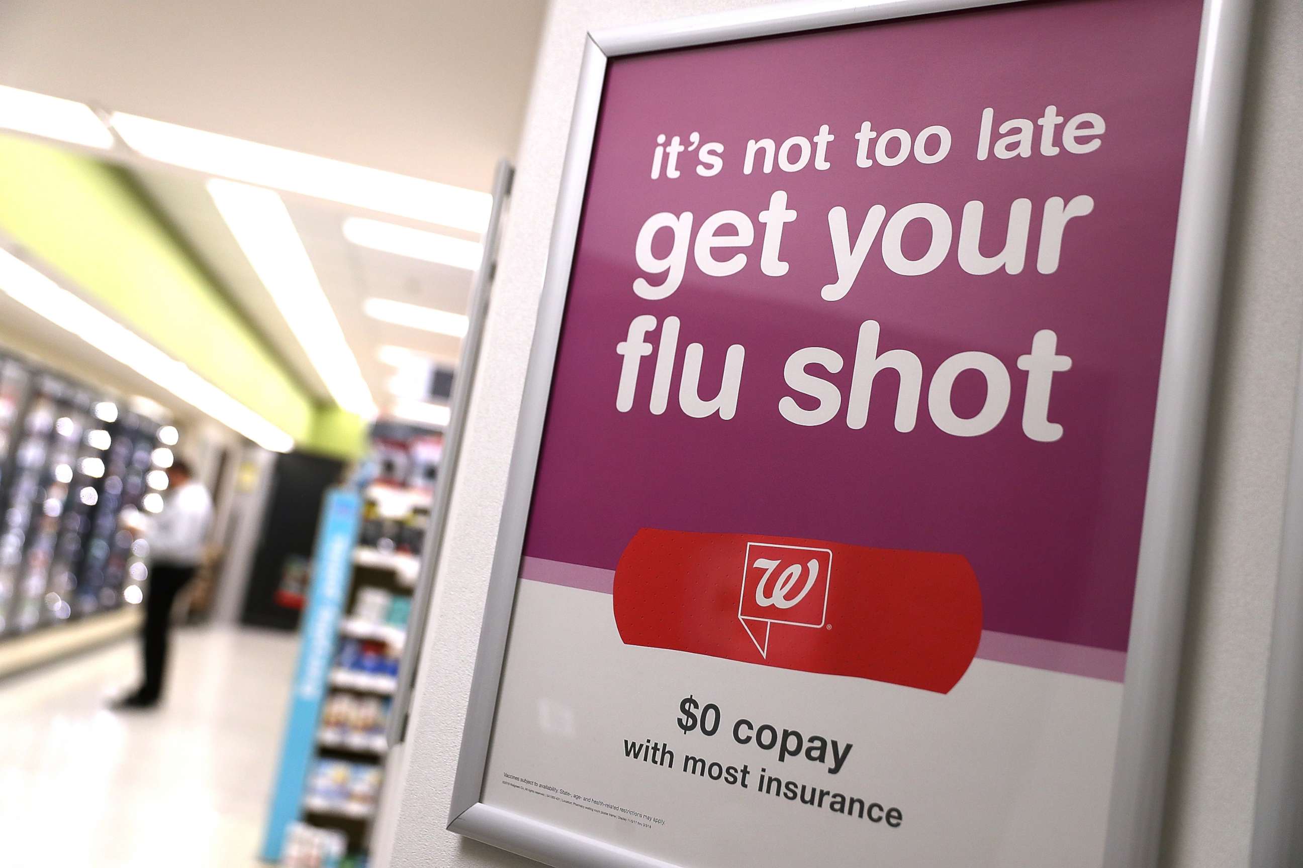 PHOTO: A sign advertising flu shots is displayed at a Walgreen's pharmacy on Jan. 22, 2018, in San Francisco. 