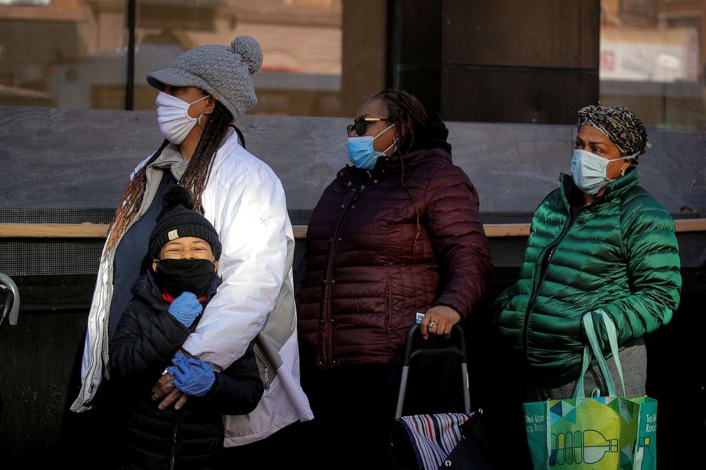 PHOTO: People line up to receive free holiday boxes of food from the Food Bank For New York City ahead of the Thanksgiving holiday, as the global outbreak of the coronavirus disease (COVID-19) continues, in New York, U.S., November 16, 2020.  