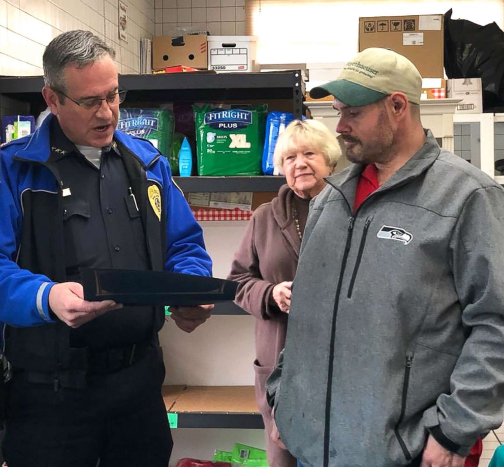 PHOTO: Chief Brad Moericke presents Kevin with a Police Chief citation at Sumner Community Food Bank, Nov., 29, 2018.