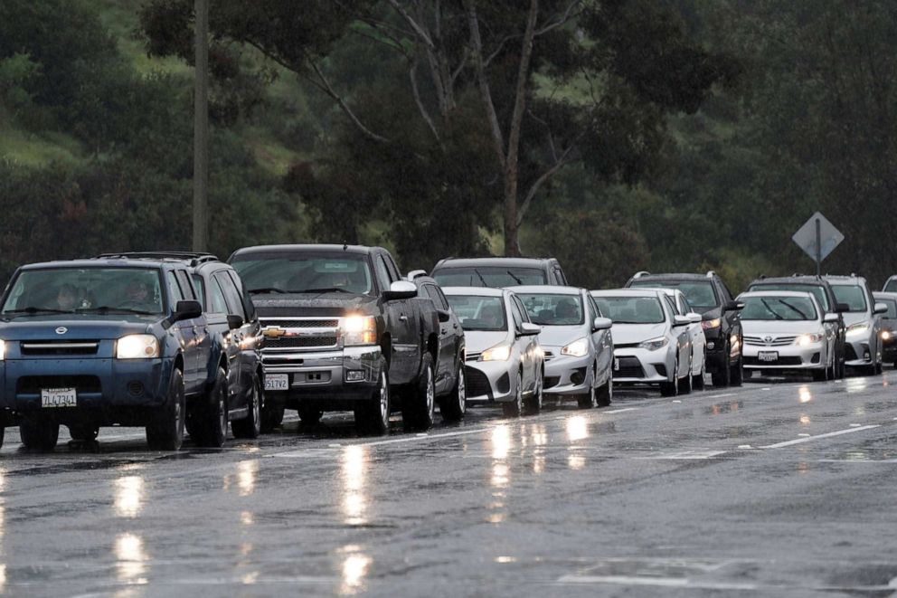 PHOTO: People line up in their vehicles for an emergency drive-through food and toilet paper distribution hosted by the San Diego Food Bank near the U.S.-Mexico border, amid the coronavirus disease outbreak, in Chula Vista, Calif., April 10, 2020.