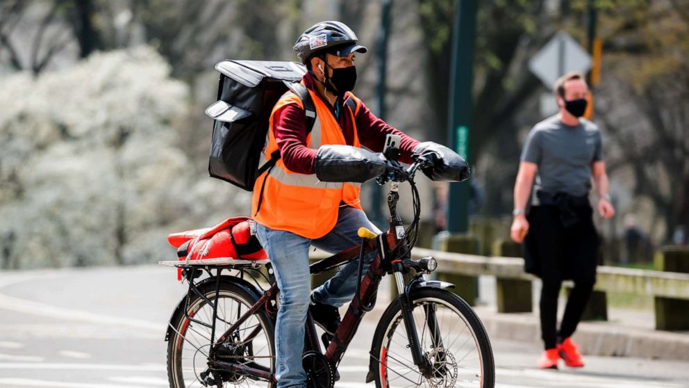 PHOTO: A delivery person rides a bicycle in Central Park amid the coronavirus pandemic, April 10, 2021, in New York City.