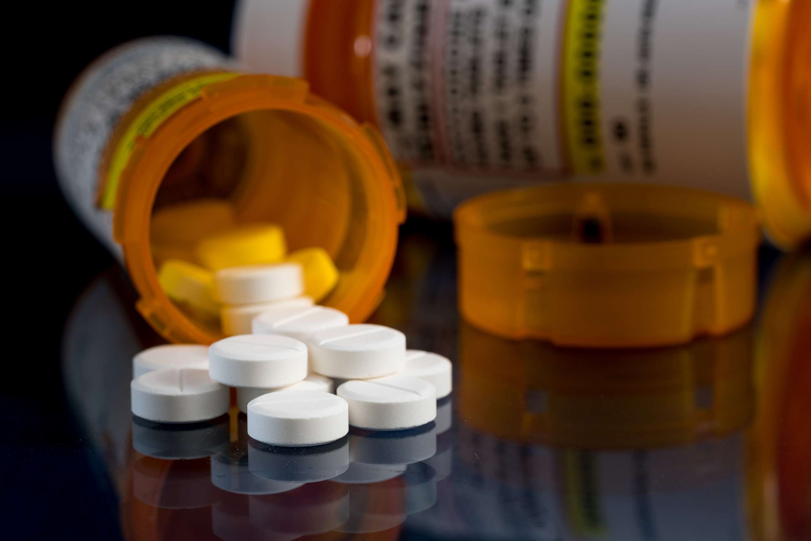 PHOTO: Opioid painkiller tablets spill out of a prescription bottle in an undated stock image.