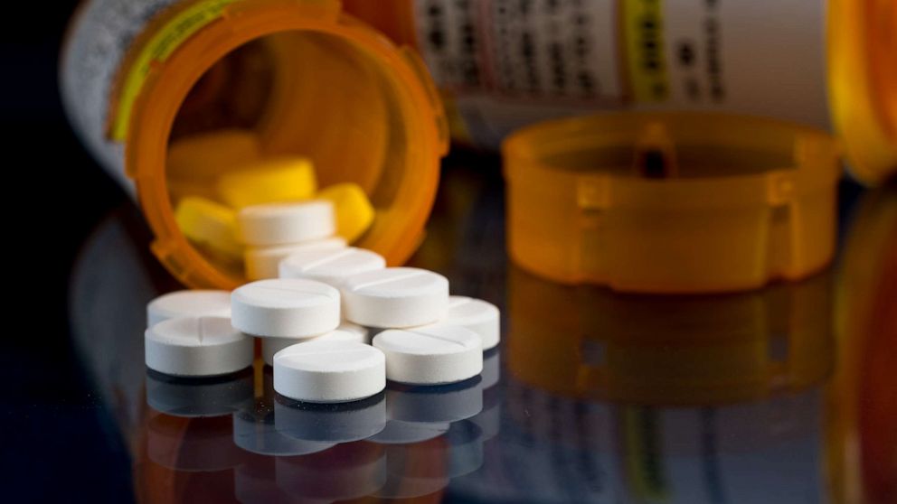 PHOTO: Opioid painkiller tablets spill out of a prescription bottle in an undated stock image.