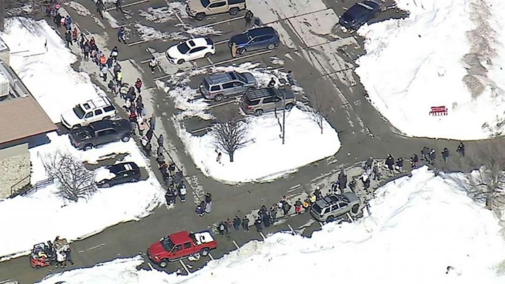 PHOTO: People wait in line for food at a supermarket in Crestline, Calif., on March 3, 2023.