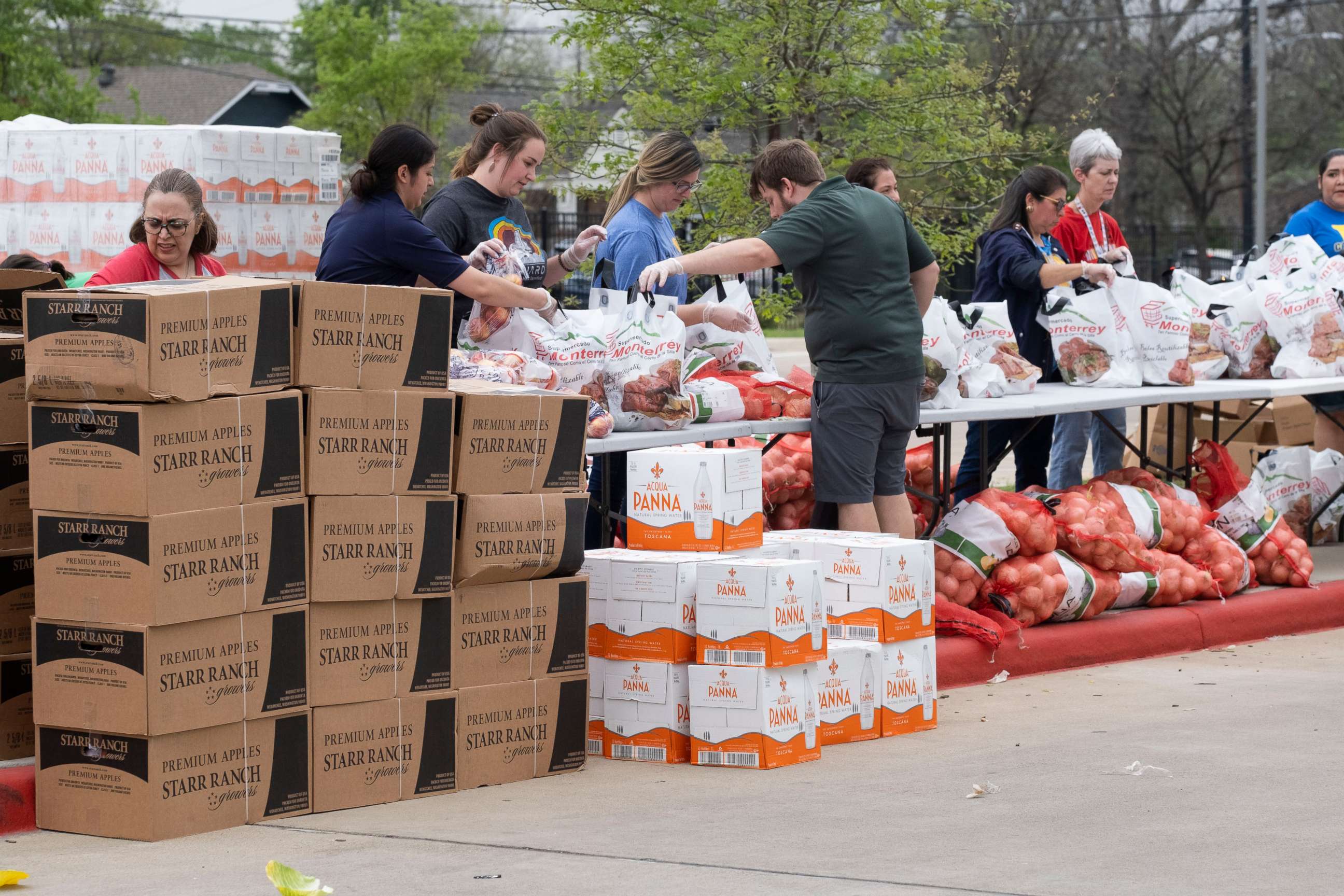 PHOTO: Free food is provided to families by the Houston Independent School District, along with the Houston Food Bank, at area high schools during the outbreak of Covid-19, March 16, 2020.